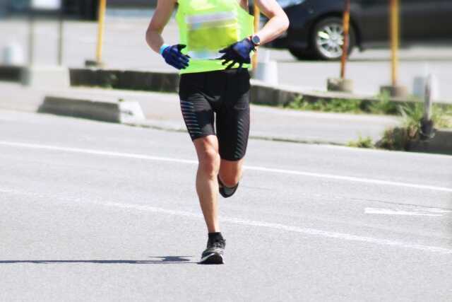 A lone runner separated from the crowd